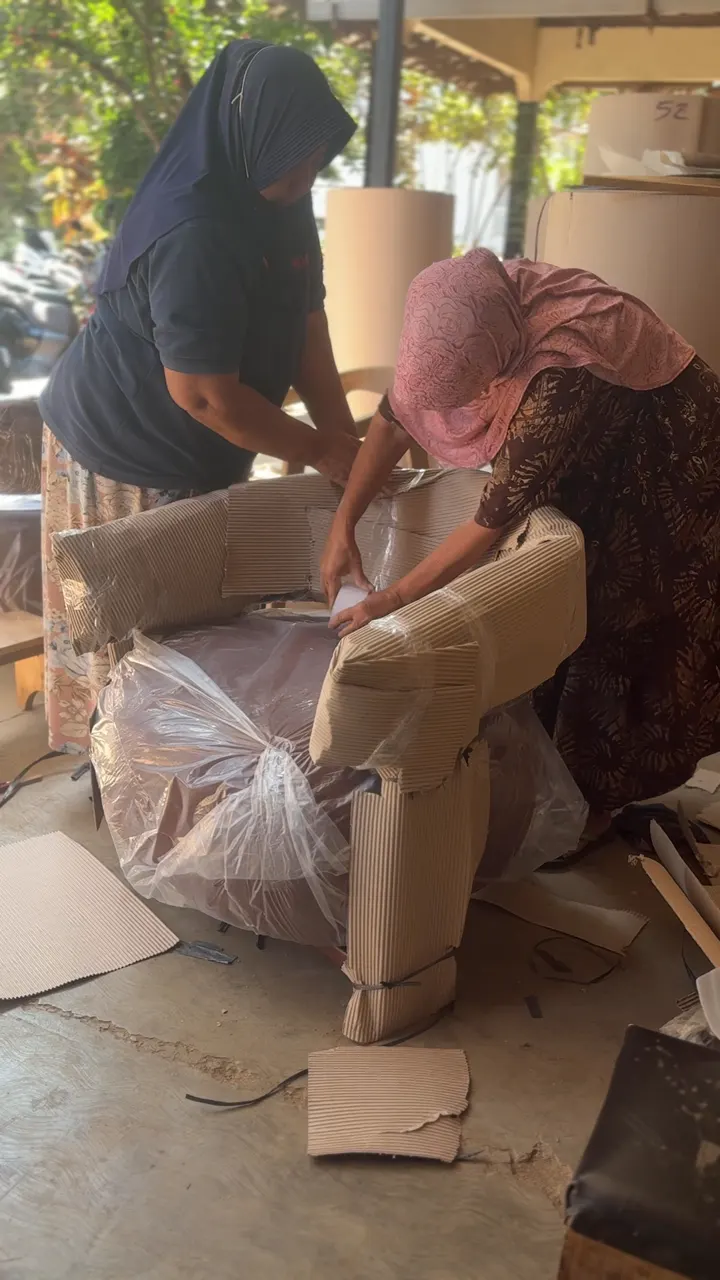 Wrapping a sofa in cardboard