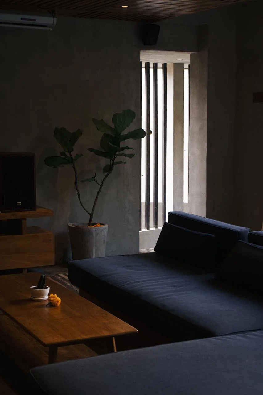 Handcrafted wooden furniture with retro warm tones in 1960s-influenced hotel lobby, Bali