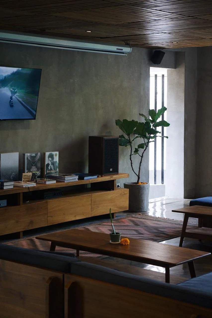 Surf Motel corridor with natural wood panelling and retro-inspired light fixtures, Bali