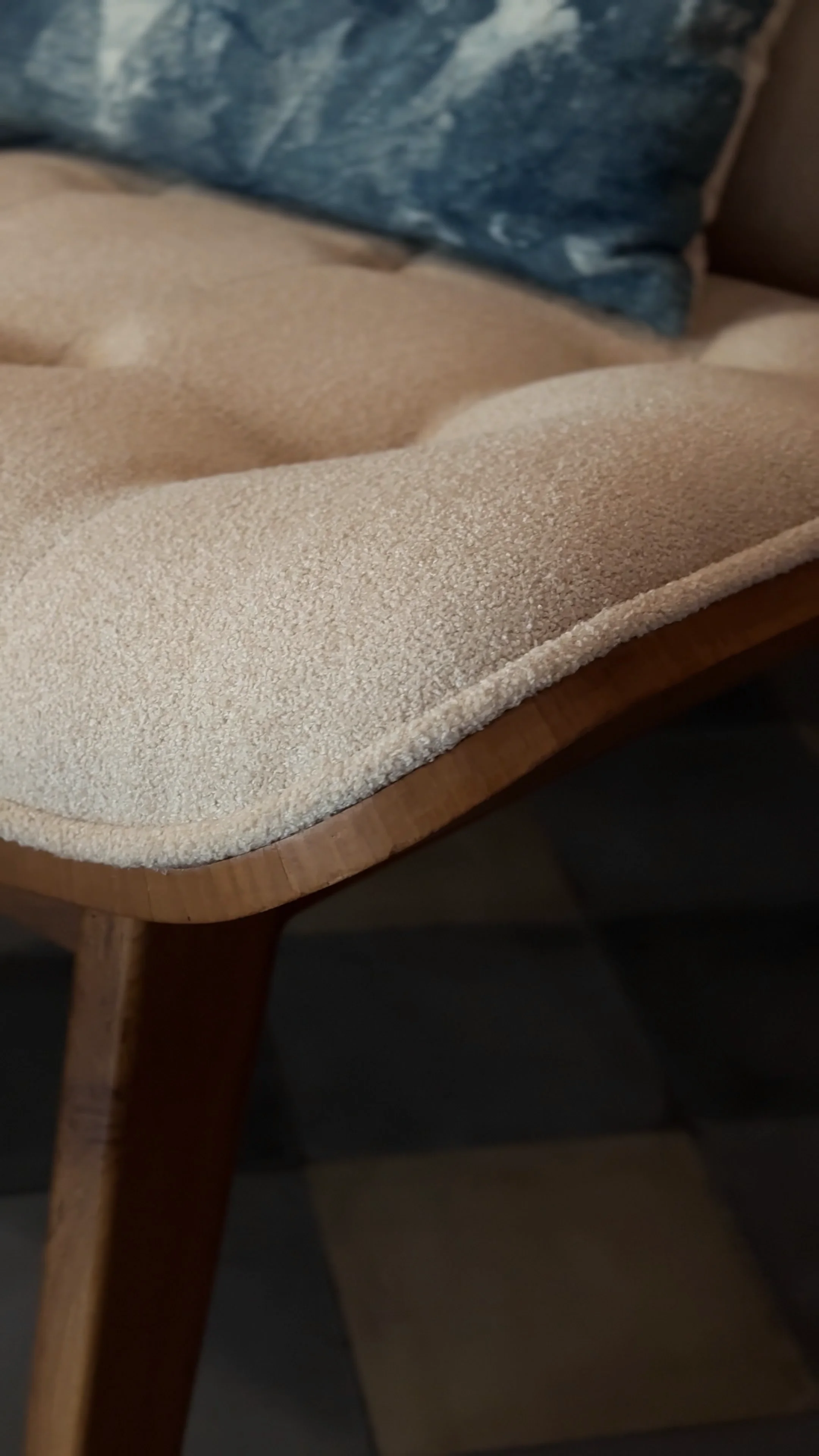 Handcrafted low-profile furniture with warm earthy tones in open Joglo interior